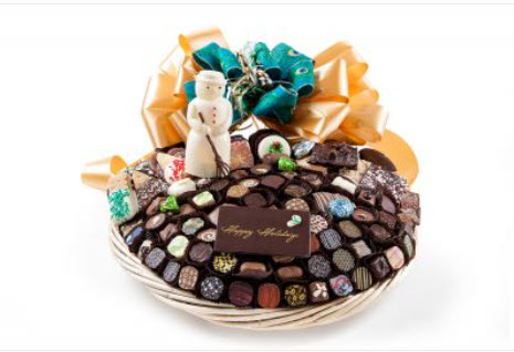 Bskt has 112 truffles, chocolates, cookies, pretzels, chocolate plaque - Happy Holidays & snowman, foil cvrd snowflakes & trees