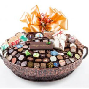 Exotic Bronze vessel with 105 pc of chocos, white chocolate snowman & foil cvrd snowflakes & trees