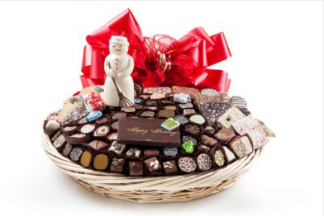 Bskt has 140 truffles, chocolates, cookies, pretzels, chocolate plaque - Happy Holidays & snowman, foil cvrd snowflakes & trees