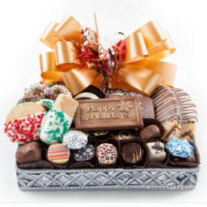 Sm: Silver basket has chocolate pretzels, grahams, Oreo cookies, Biscotti, shortbread cookies, and chocolates and truffles