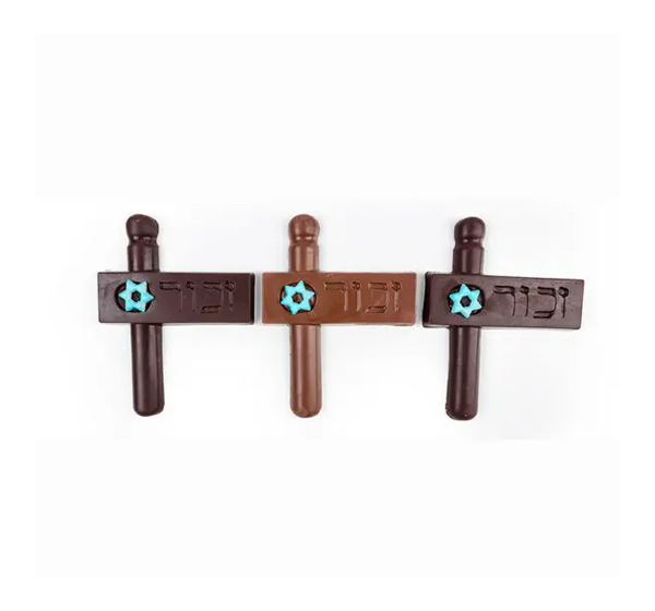 Solid choco Purim Groggers engraved with the word "Zachor" wrapped & tied with colorful ribbons